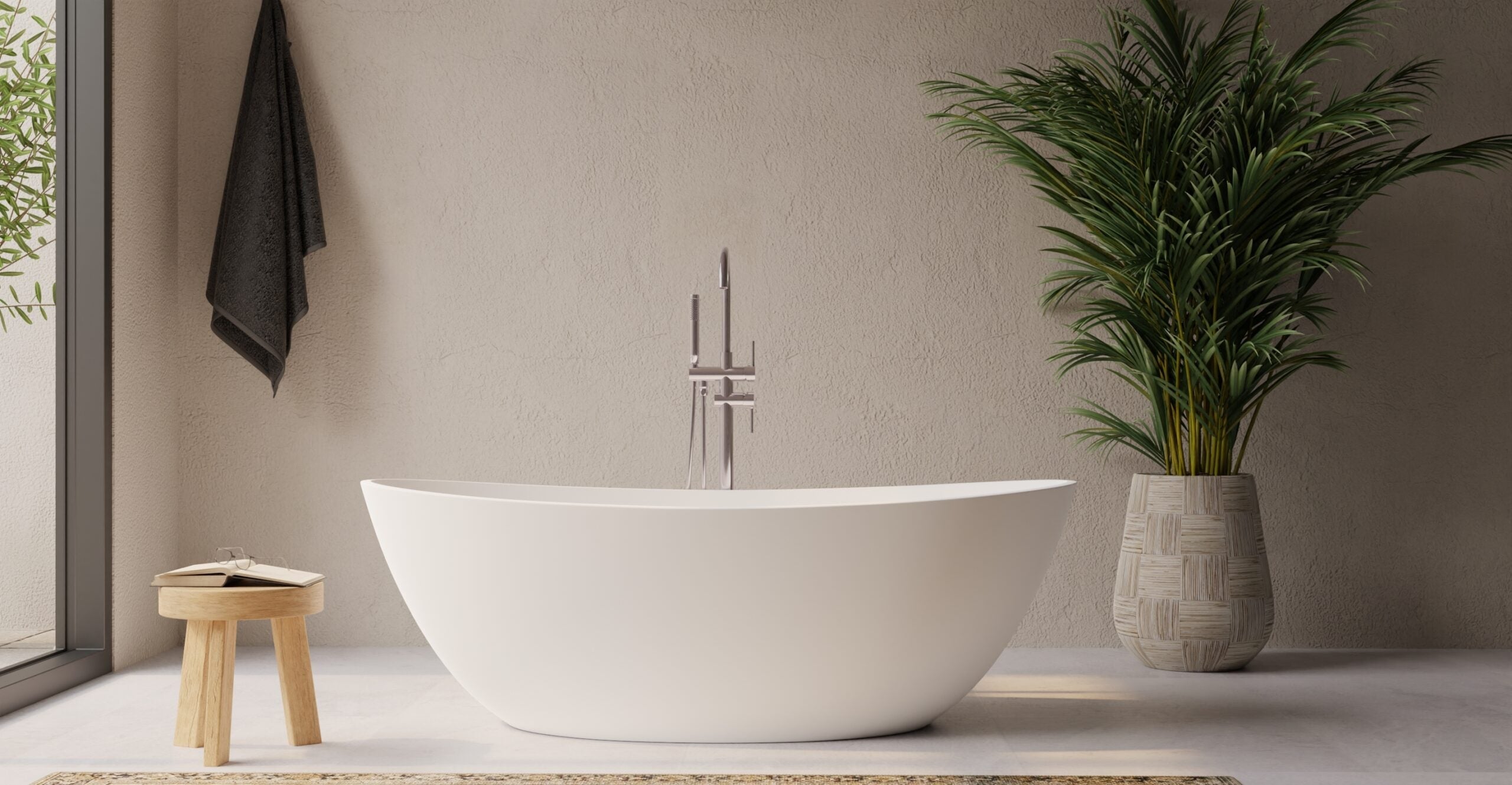 Bañera independiente blanca con llave de piso y planta