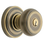 Baldwin Hardware Juego de Entrada con Llave 5210 — Perilla Colonial con Roseta Clásica — Latón antiguo