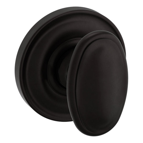 Baldwin Hardware Perilla 5057 con Roseta 5048 — Bronce aceitado — Paso