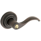 Baldwin Hardware Juego de Entrada con Llave 5255 — Manija Wave con Roseta Clásica — Bronce aceitado envejecido