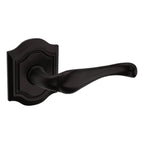 Baldwin Hardware Manija 5447V con Roseta R027 — Bronce aceitado — Paso