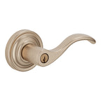 Baldwin Hardware Juego de Entrada con Llave 5255 — Manija Wave con Roseta Clásica — Latón satinado café