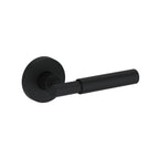 Baldwin Hardware Manija Reserve Riddling — Negro satinado — Contemporary Round — Medio Dummy