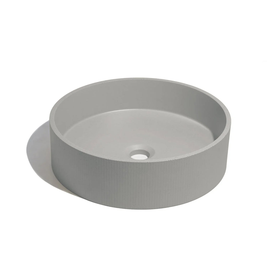 Lavabo de concreto circular en color gris