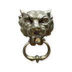 toca la puerta laton lion